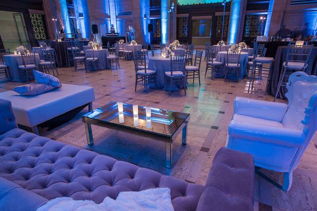 Tables and chairs set up for a reception inside the Asian Art Museum, San Francisco, CA.