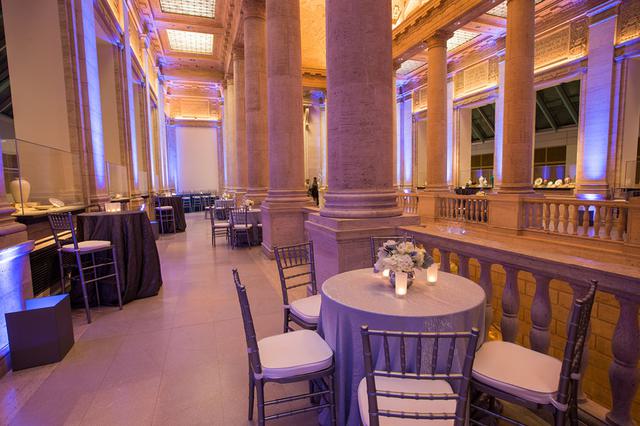 Tables and chairs set up for a reception inside the Asian Art Museum, San Francisco, CA.