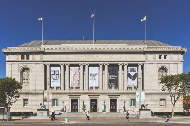 View of the entrance to the Asian Art Museum in San Francisco, CA on a sunny day.