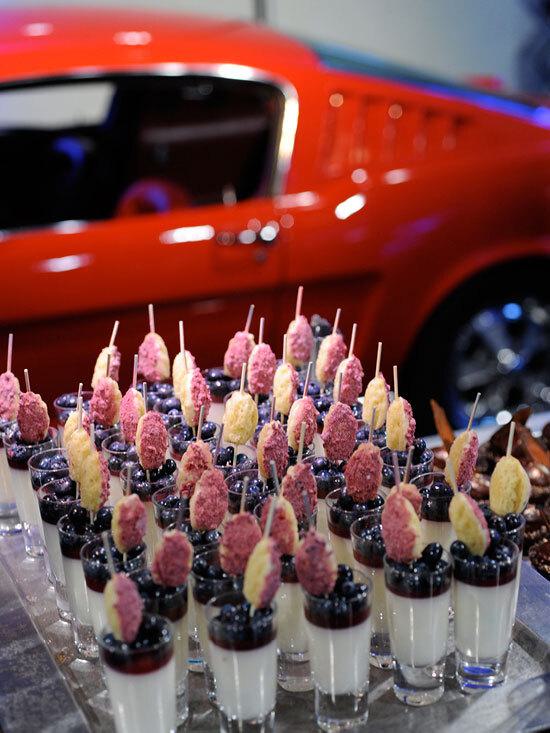Parfait shooters on a tray with a red car in the background at Club Auto Sport, San Jose, CA.