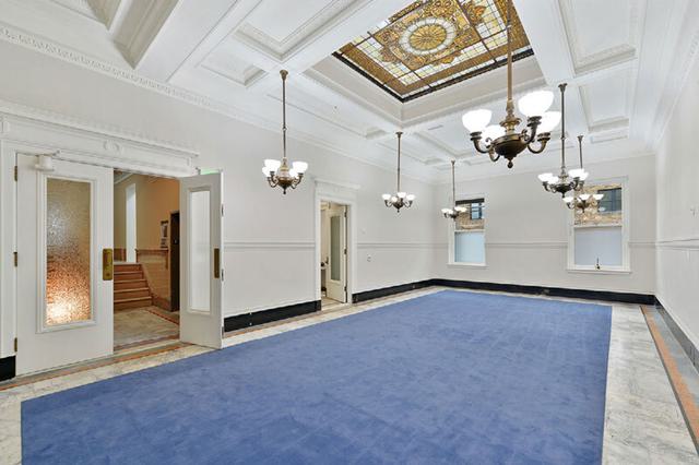 Looking down a columned hallway at The Hibernia in San Francisco, CA.