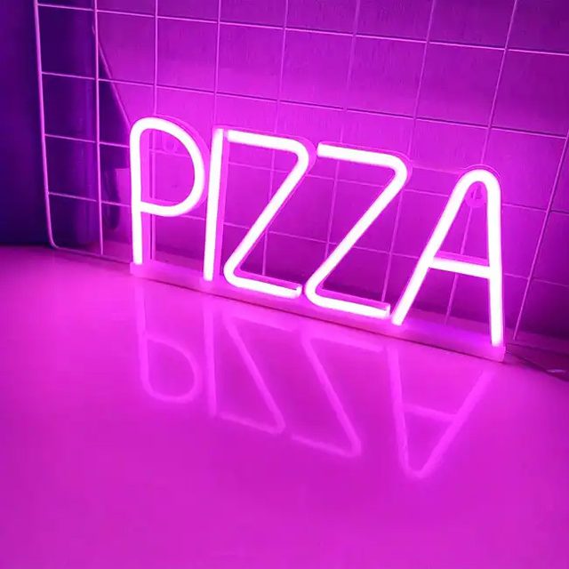 Pink neon sign that says pizza in front of a tile wall.